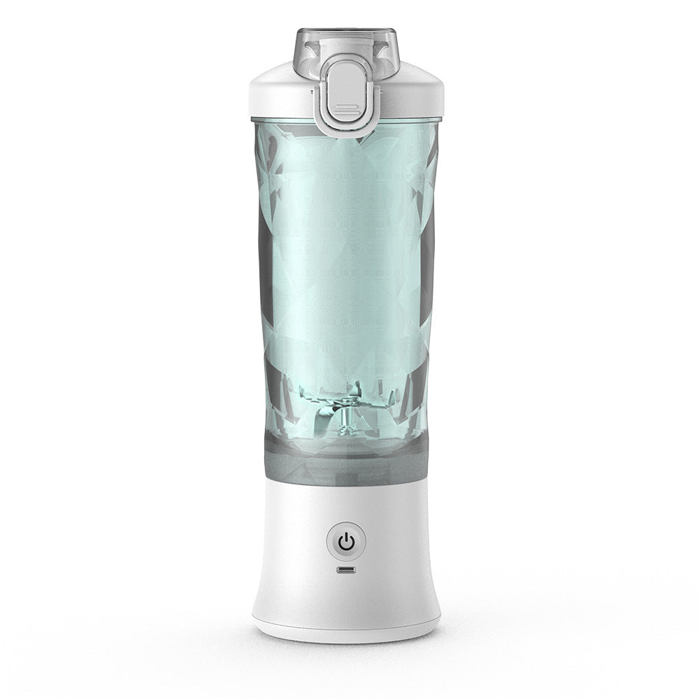 Portable blender juicer, clear cup with white base and mint blade area
