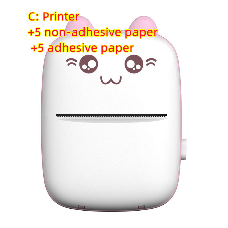Pink portable mini label printer with cute face graphic and paper feed slot