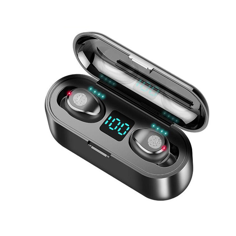 Black charging case with earbuds seated inside, glowing blue LED bar and digits