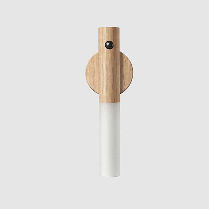 Light-wood magnetic night light with round cap, white cylinder, and sensor dot