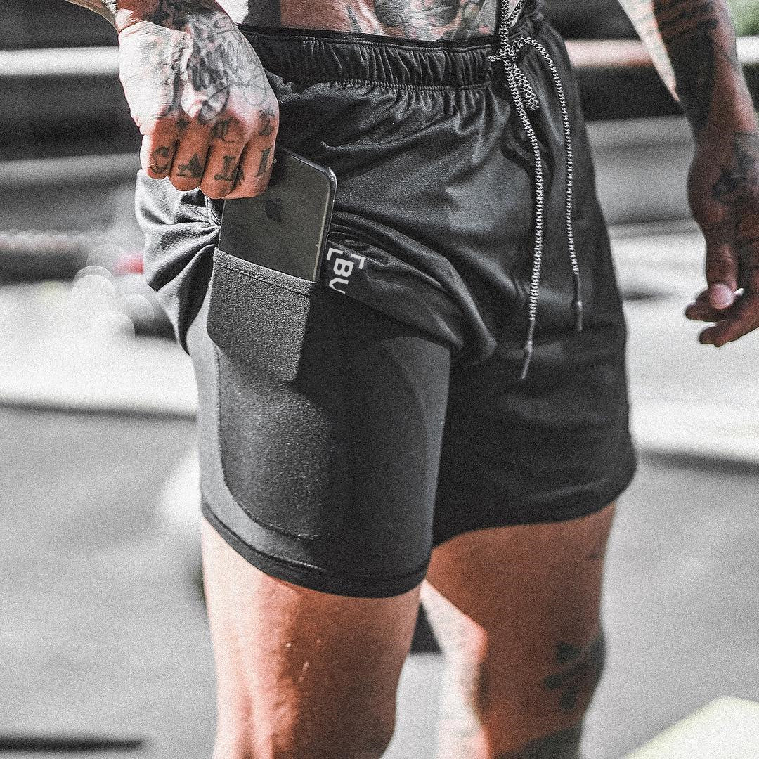 Black pocket compression shorts with front side pocket and drawstring waistband