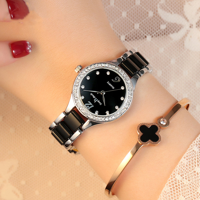 Women quartz wrist watch with black dial, silver bezel, black link bracelet
