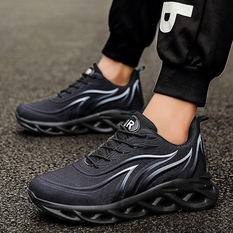 Black lace-up running shoes with silver stripe accents and textured upper
