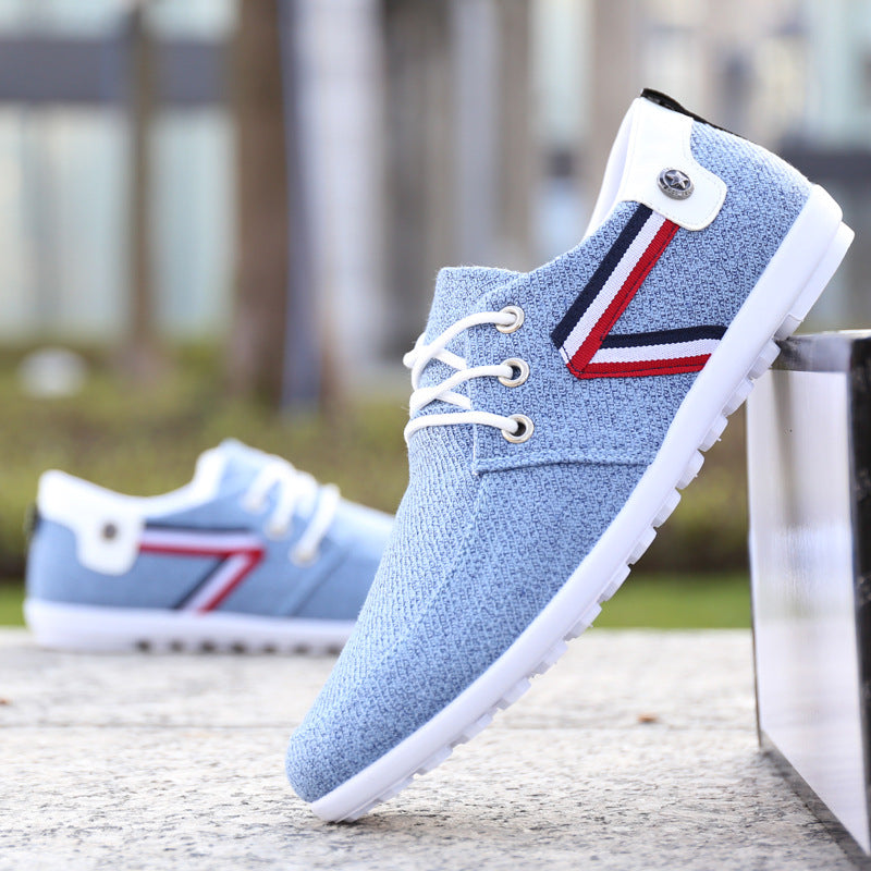 Light blue canvas ankle lace-up shoe with white sole and tricolor side panel