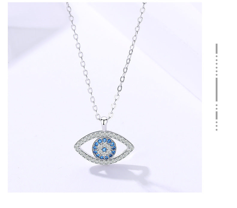 Sterling silver evil eye pendant necklace featuring blue eye center with sparkling rim