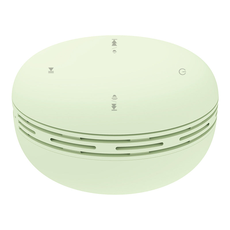 Mini Bluetooth speaker, light green round design with vented side ring and top control icons