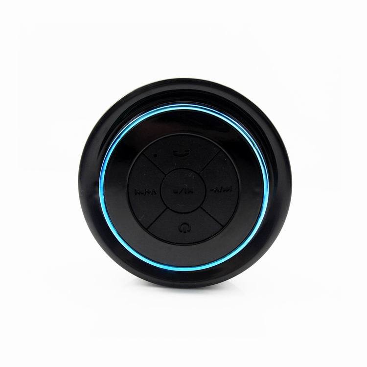 Bluetooth waterproof speaker front with blue LED ring and circular control panel