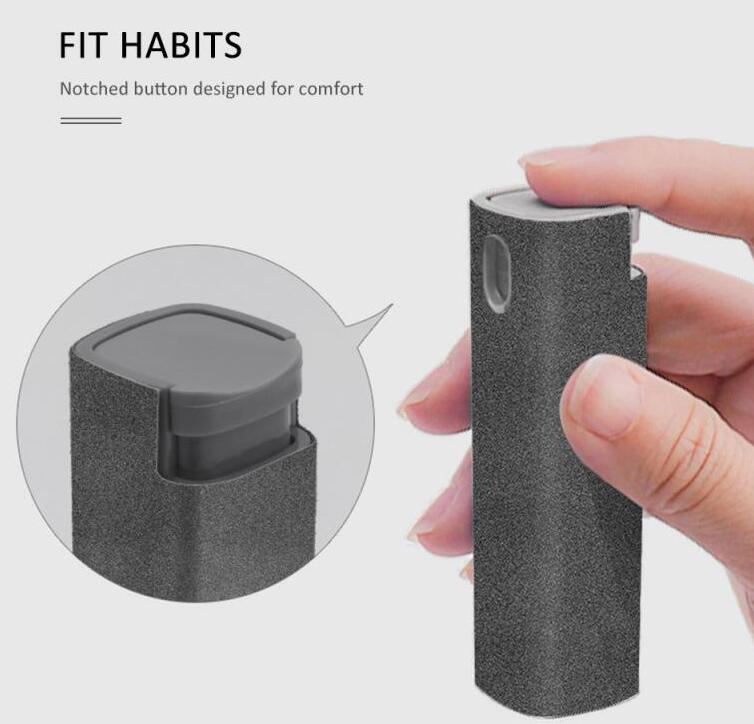 Portable screen cleaner spray bottle with gray microfiber cloth, held for use