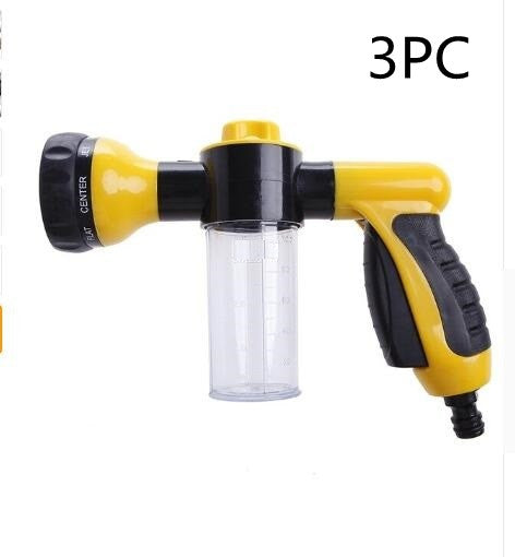 Foam spray gun with yellow-and-black grip and clear bottle reservoir