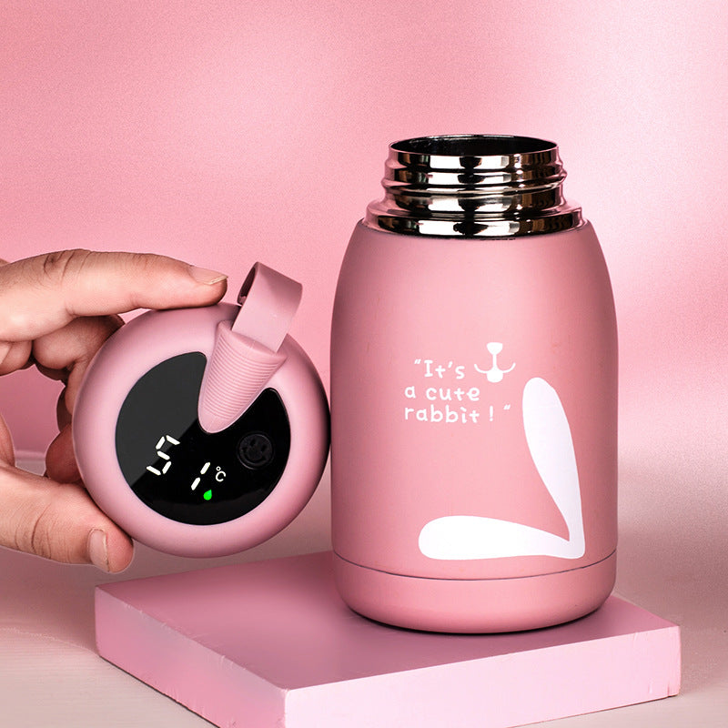 Pink insulated thermos bottle with digital temperature display and carrying handle
