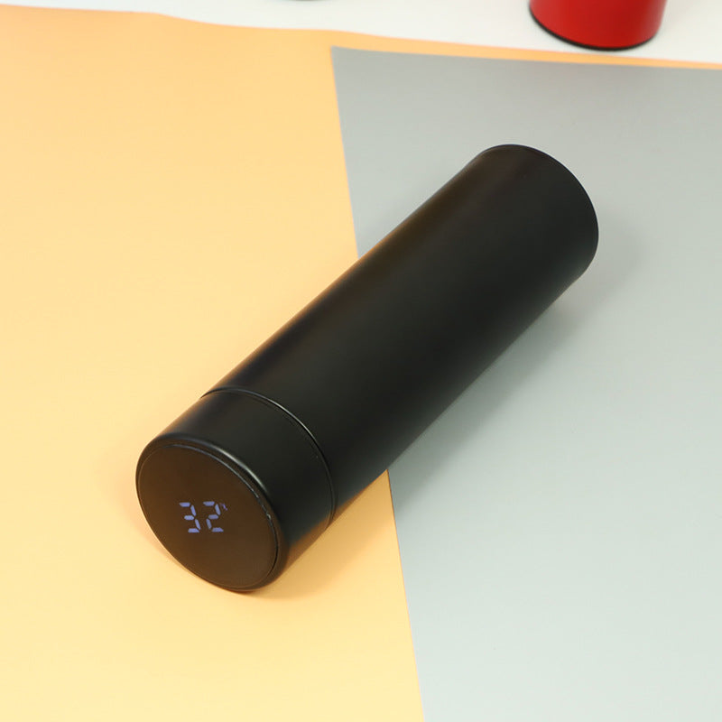 Black insulated vacuum bottle with LED temperature display on dark end cap