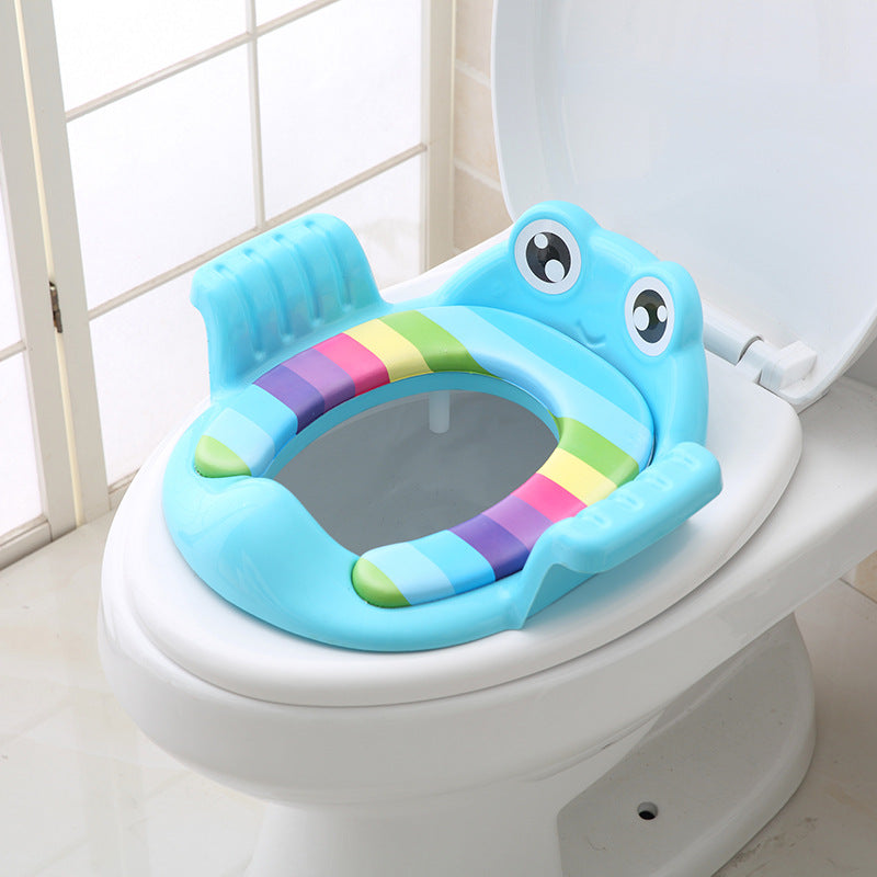 Blue toddler toilet seat with animal face, striped inner pad, and side grips