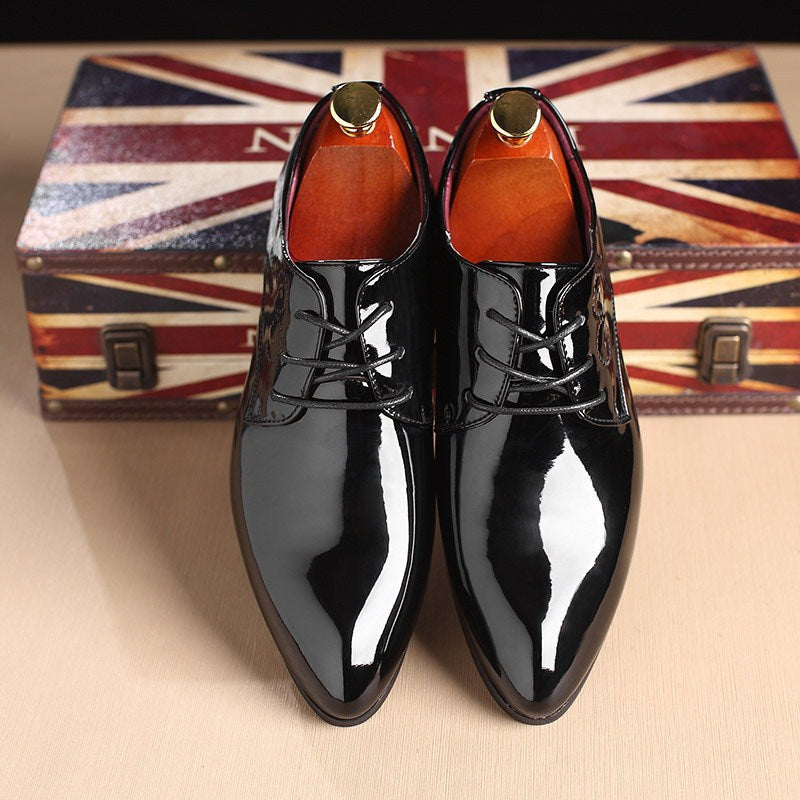 Men’s leather dress shoes in black, glossy finish, lace-up, pair from above