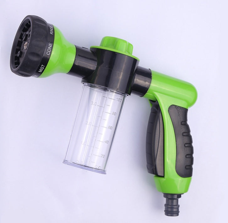 High-pressure foam spray gun with clear cup, green nozzle head, and black trigger