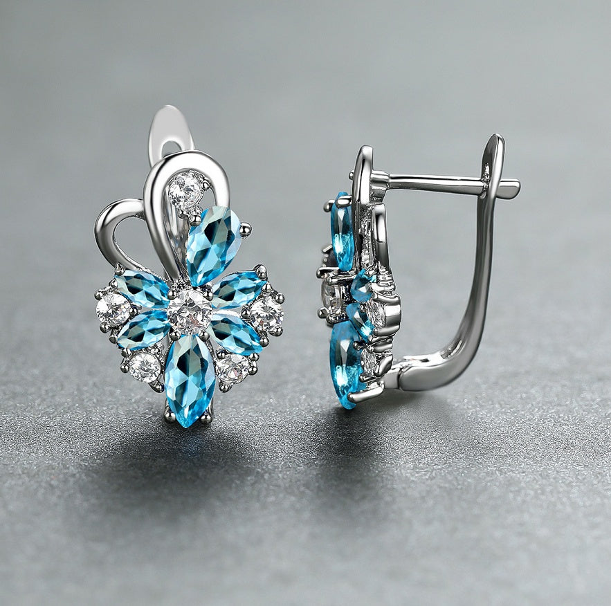 Silver flower drop zircon earrings with blue and clear stones