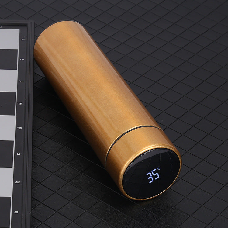 Gold 500ml smart vacuum bottle angled view, LED temperature display shows 35°C