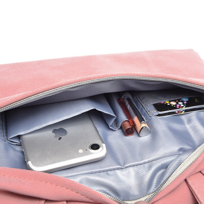 Pink laptop bag open view with gray interior lining and small pocket for phone