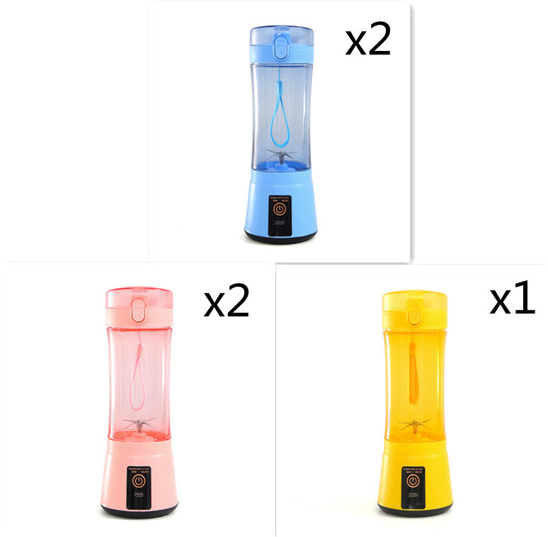Portable electric fruit juicer blender with clear cup and light blue, pink, yellow bases