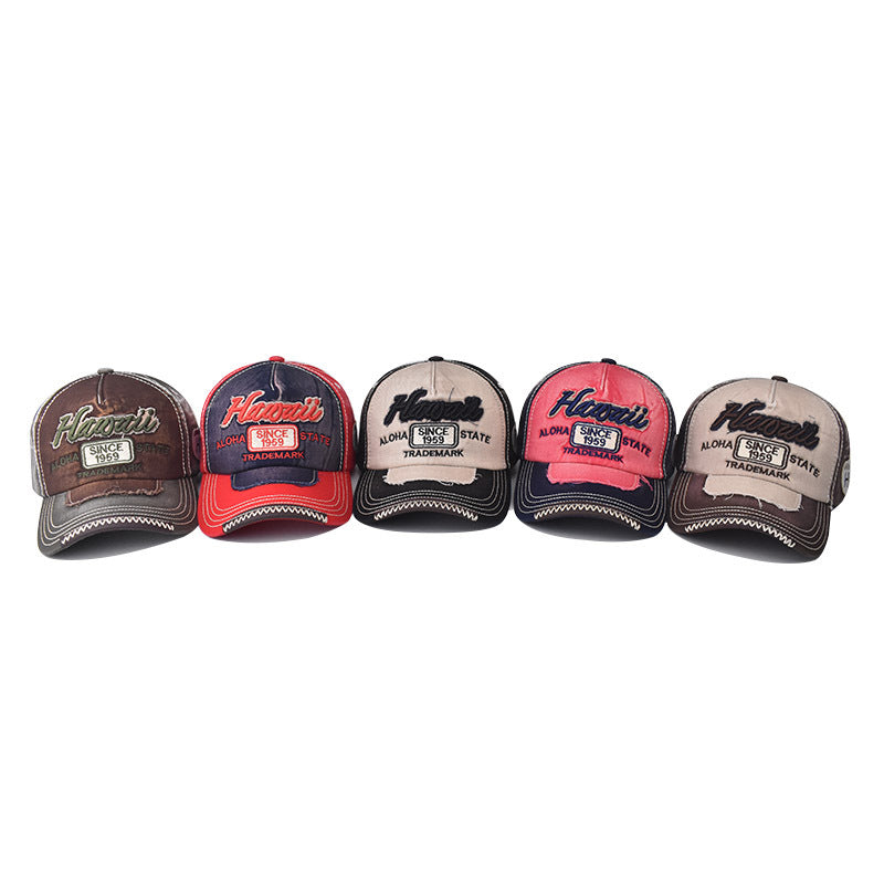 Row of five embroidered baseball caps in mixed colors: brown, red, black, and tan