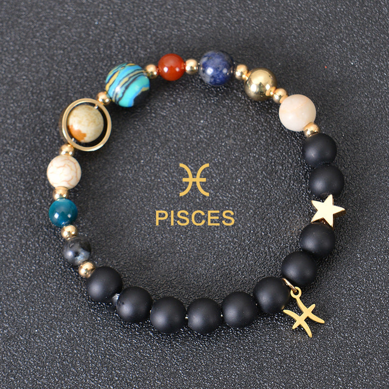 Pisces zodiac beaded bracelet with black lava stones and star charm, gold accents