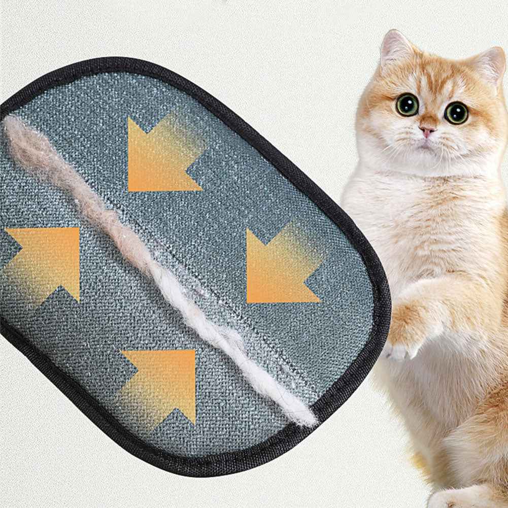 Gray bristle pet hair removal mitt with yellow tab and black border, close-up