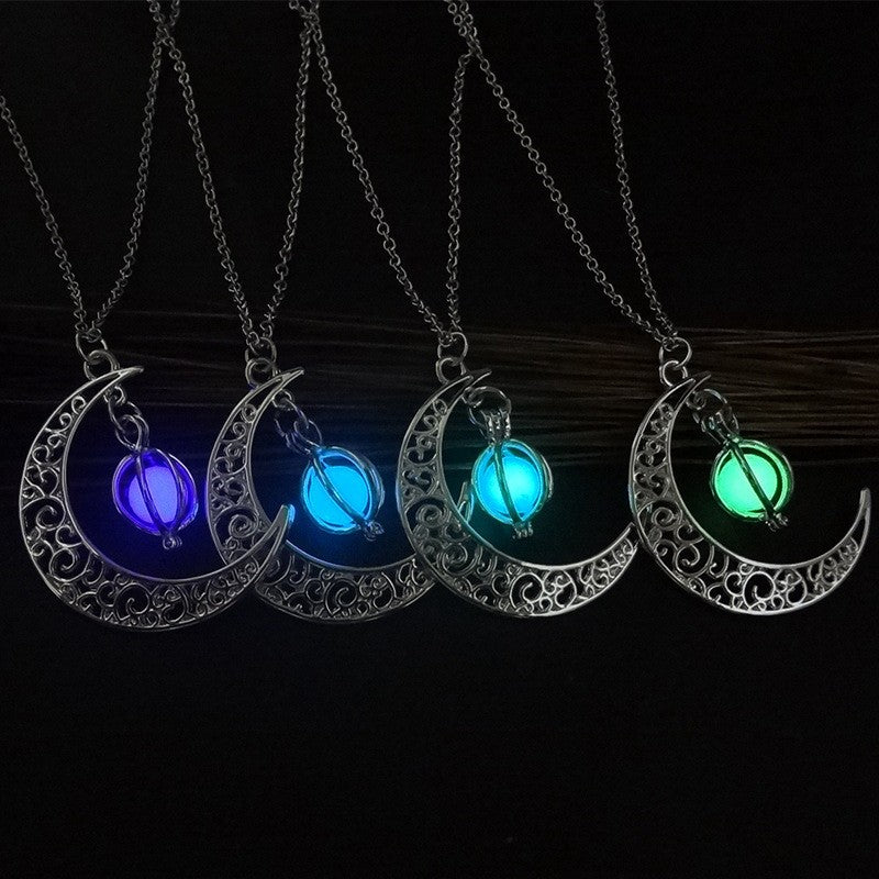 Silver crescent moon pendant necklace with glowing purple, blue, teal, and green stones