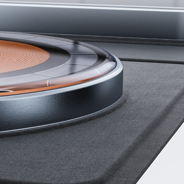 Black wireless charging pad with glowing orange coil ring and blue LED light