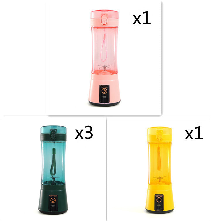 Portable electric fruit juicer with pink, teal, and yellow blender cups