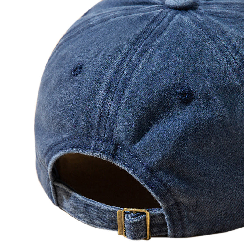 Denim blue baseball cap with stitched panel seams and adjustable back strap