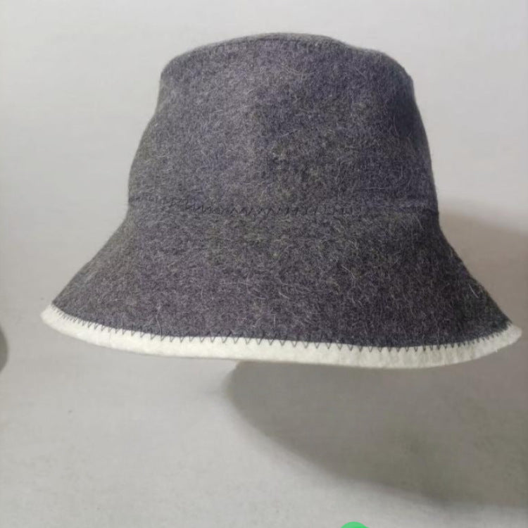Dark gray wool bucket hat with off-white brim and contrast edge stitching