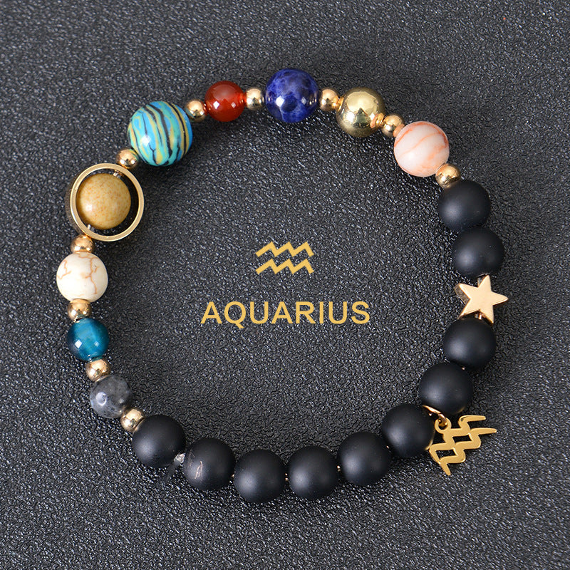 Aquarius zodiac beaded bracelet with black lava stones and gold star charm