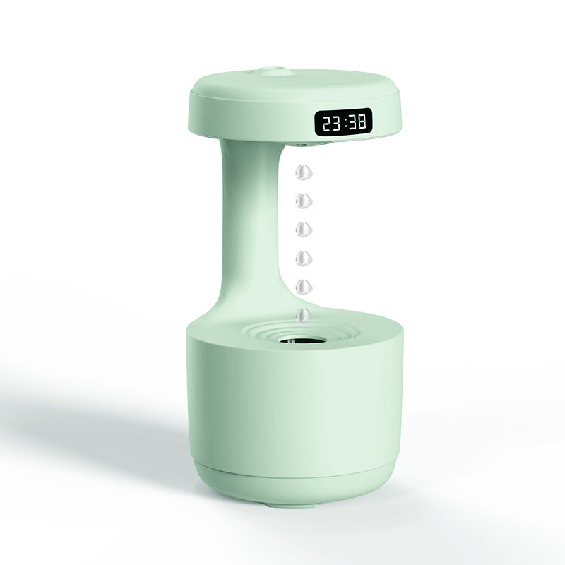 Mint green cool mist humidifier with digital display and central water drop nozzle