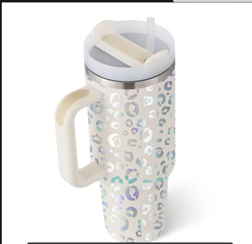 Insulated tumbler with handle, white patterned body, stainless lid and clear straw