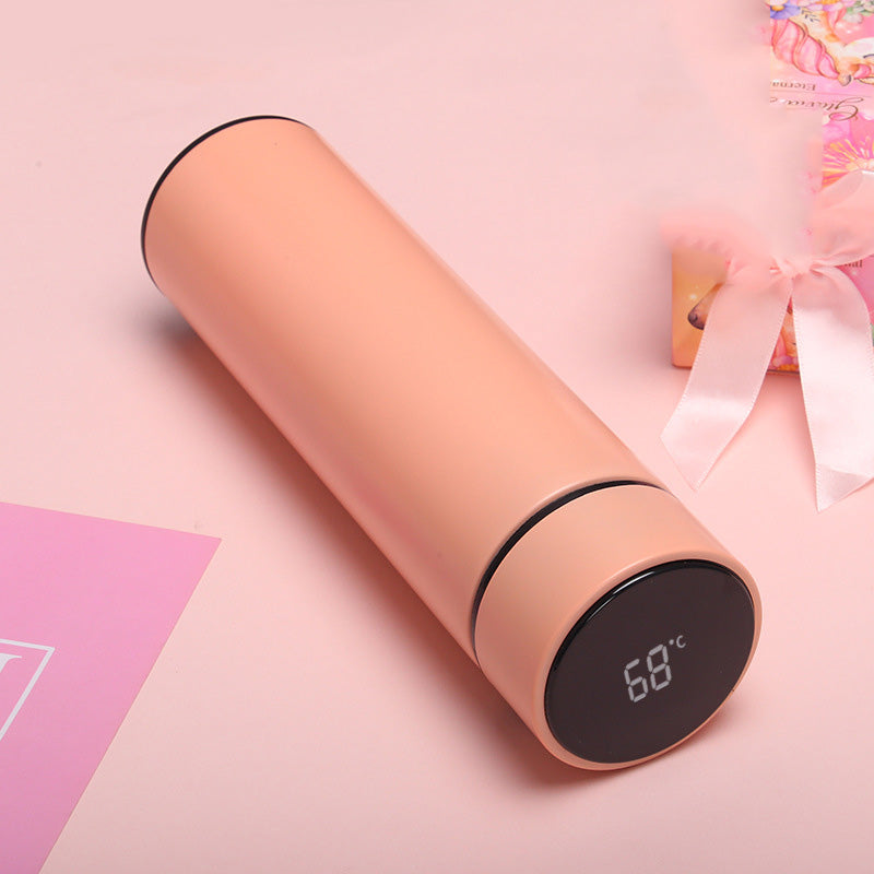 Blush pink insulated vacuum bottle with LED temperature display on dark end cap