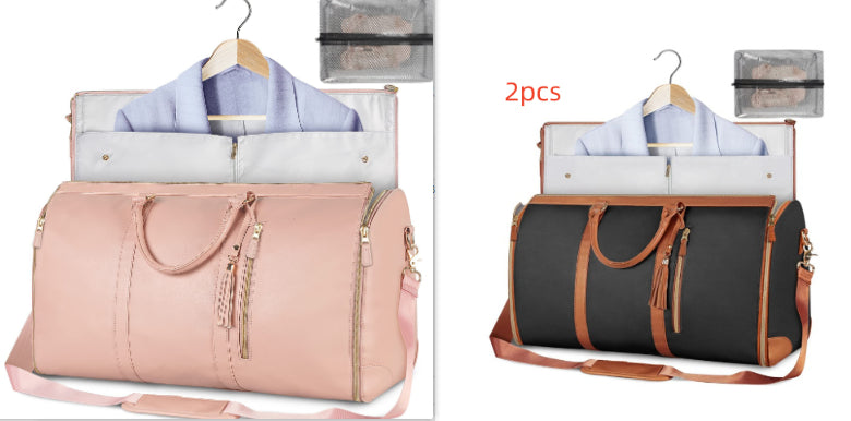 Blush pink foldable travel duffle bag with front zipper, tassel detail, shoulder strap