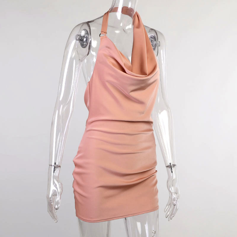Satin party dress on mannequin, sleeveless mini with V-neck backless drape, pink