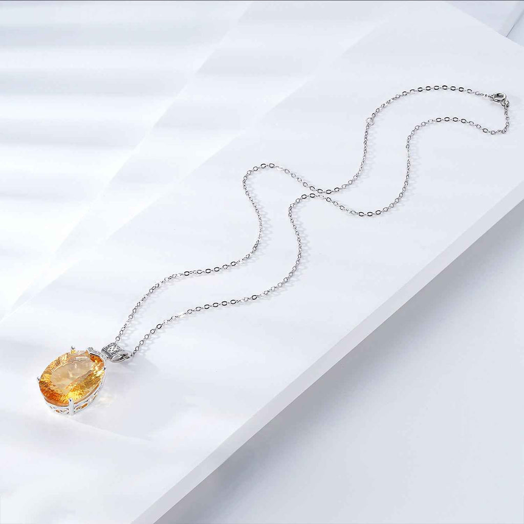 Silver chain necklace with yellow gemstone teardrop pendant