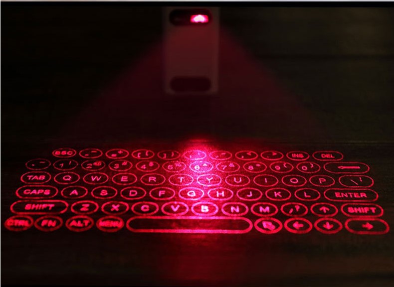 Red laser projected keyboard pattern on a dark surface