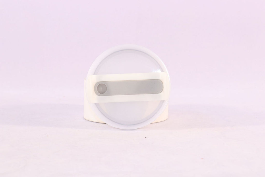 Tumbler lid with straw opening and gray slider, translucent top disc.