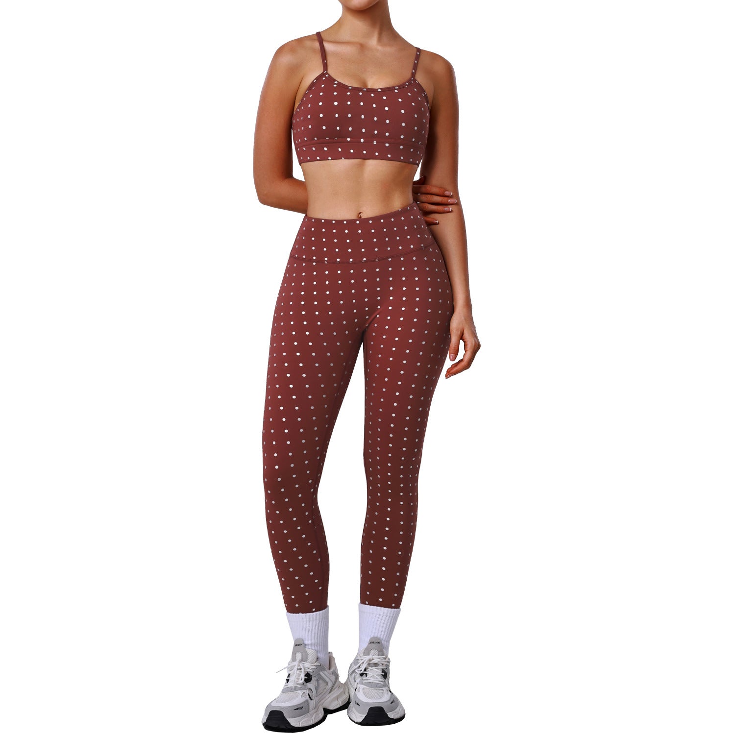 Women’s rust red sports bra and workout pants set with white dot print, slim fit