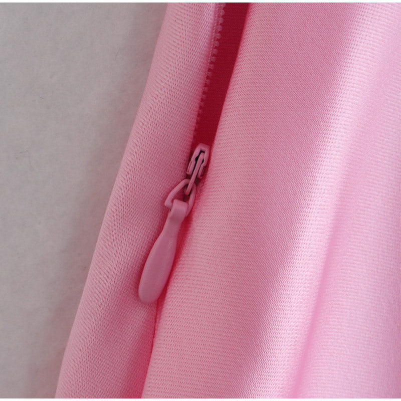 Pink satin dress fabric with visible zipper at side seam