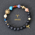 Aries zodiac beaded bracelet with black matte beads, colorful stone beads, and gold star charms