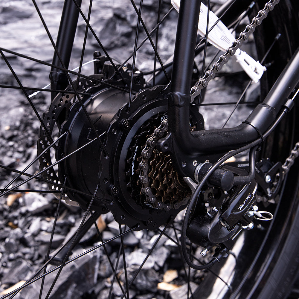Black rear hub motor with chain drive and disc brake, fat-tire e-bike close-up
