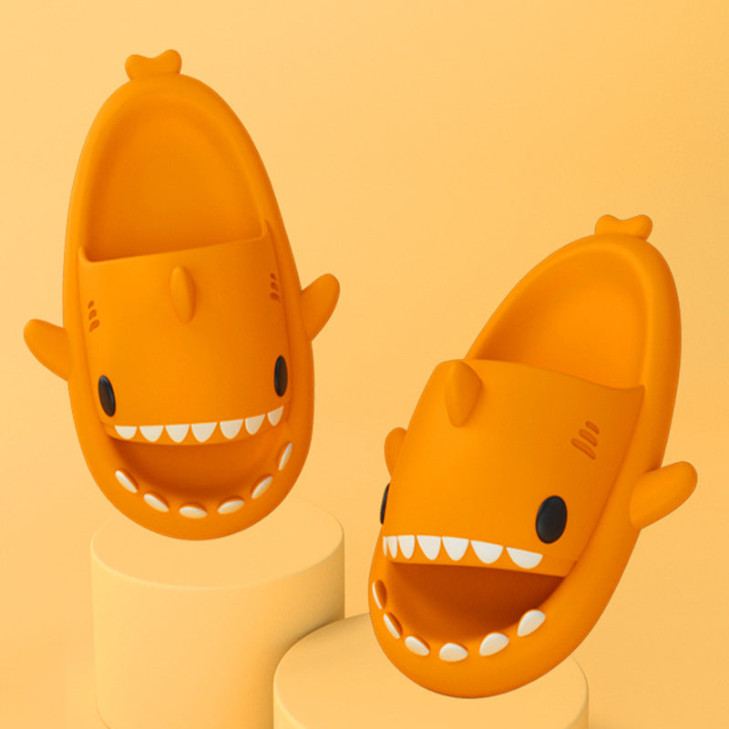 Cartoon shark slippers in yellow, open-toe slip-on with teeth detail and fins