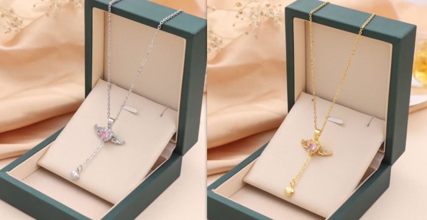 Silver angel-wing charm necklace with crystal heart pendant, in green gift box