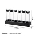 Bottle display rack for 6 bottles: clear tubes with black caps on a plastic base.