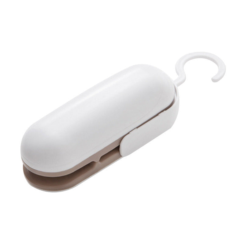 Mini portable heat sealer tool in white with compact body and hanging hook