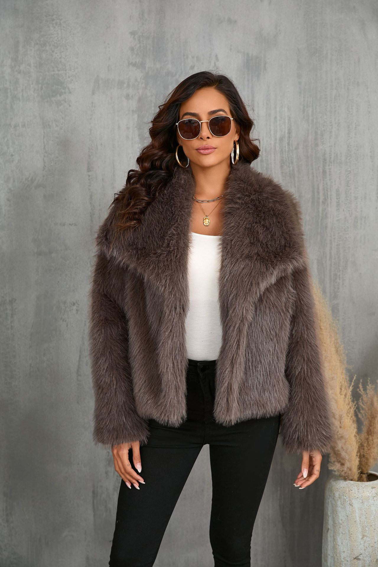 Dark brown plush faux-fur jacket with notched lapels and long sleeves