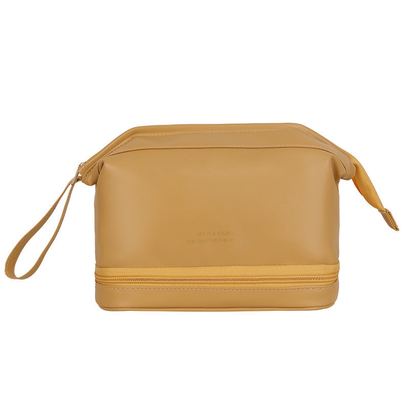 Large travel cosmetic bag in mustard yellow with top zipper and side draw cords