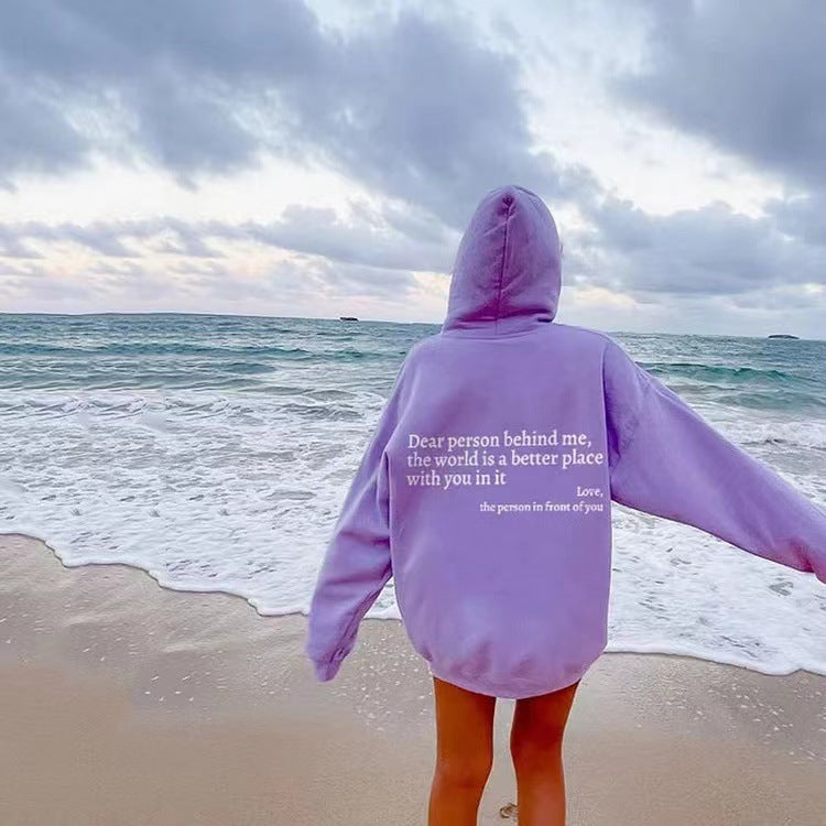 Lavender plush hoodie with hood, drawstrings, kangaroo pocket, and printed back message